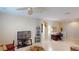 Spacious living room with tile flooring, arched doorways, and office space at 116 Navigation Cir # 106, Osprey, FL 34229