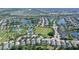 The aerial view shows a property near a community park with lakes and mature trees at 12133 Forest Park Cir, Bradenton, FL 34211