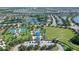 An aerial view of the community recreation area offers pools, tennis courts, green spaces, and a playground at 12133 Forest Park Cir, Bradenton, FL 34211