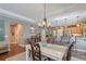 Dining room with hardwood floors, a chandelier, and an open layout at 12133 Forest Park Cir, Bradenton, FL 34211