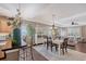 Open-concept dining area with modern decor, elegant lighting, and seamless flow to the living room at 12133 Forest Park Cir, Bradenton, FL 34211