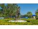 Bronze statue of a boy and dog hugging in a landscaped common area of a dog-friendly community at 12133 Forest Park Cir, Bradenton, FL 34211