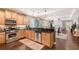 Modern kitchen featuring granite countertops, stainless steel appliances, and ample cabinet space at 12133 Forest Park Cir, Bradenton, FL 34211