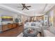 Spacious living room with hardwood floors, a ceiling fan, and an open layout at 12133 Forest Park Cir, Bradenton, FL 34211