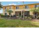 A well-manicured lawn and palm trees provide a serene outdoor living space at 12358 Destiny Dr, Venice, FL 34292