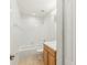 Bright bathroom with a tiled shower/tub combo and a vanity with wood cabinets at 12358 Destiny Dr, Venice, FL 34292