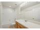 A full bathroom with a shower/tub combo, a vanity and a large mirror at 12358 Destiny Dr, Venice, FL 34292