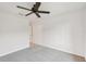 Bright bedroom features neutral carpet, ceiling fan, and ample natural light at 12358 Destiny Dr, Venice, FL 34292