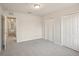 Bedroom featuring carpeted floors and dual closets at 12358 Destiny Dr, Venice, FL 34292