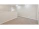 Upstairs bonus room featuring neutral carpet, base trim and light, neutral paint at 12358 Destiny Dr, Venice, FL 34292