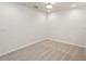Upstairs bonus room with neutral carpet, base trim and plenty of natural light at 12358 Destiny Dr, Venice, FL 34292
