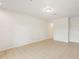 Bright living room with tile flooring and archway to other parts of the home at 12358 Destiny Dr, Venice, FL 34292