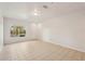 Spacious living room with tile flooring, natural light, and a bright interior at 12358 Destiny Dr, Venice, FL 34292