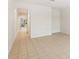 Bright living room with tile flooring and archway to other parts of the home at 12358 Destiny Dr, Venice, FL 34292