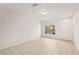 Spacious living room with tile flooring, natural light, and a bright interior at 12358 Destiny Dr, Venice, FL 34292
