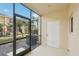 Screened-in patio offering an outdoor living space with views of community landscaping at 12358 Destiny Dr, Venice, FL 34292