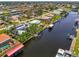 Scenic aerial shot of a neighborhood with canals and beautiful waterfront homes at 127 Colonial Sw St, Port Charlotte, FL 33952