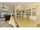 Elegant dining room with chandelier, large table, and china cabinet creating a luxurious ambiance at 127 Colonial Sw St, Port Charlotte, FL 33952