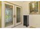 Grand foyer featuring double doors, tile flooring, and elegant decor at 127 Colonial Sw St, Port Charlotte, FL 33952