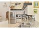 Stylish kitchen with stainless steel appliances and granite countertops offering a functional space at 127 Colonial Sw St, Port Charlotte, FL 33952
