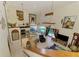 Open floor plan with high ceilings, kitchen, and living area overlooking the pool area at 127 Colonial Sw St, Port Charlotte, FL 33952
