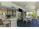 Enclosed patio with bar, dining area and views of the property at 127 Colonial Sw St, Port Charlotte, FL 33952
