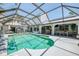 Enclosed pool with clear blue water and plenty of room for entertaining outdoors at 127 Colonial Sw St, Port Charlotte, FL 33952