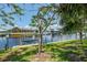 Pictureque waterfront view showing the boat lift on this beautful channel at 127 Colonial Sw St, Port Charlotte, FL 33952