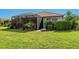 Well-maintained backyard showcasing a screened patio and lush landscaping at 1313 Thornapple Dr, Osprey, FL 34229