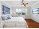 Bedroom with hardwood floors, light walls, and a window with blinds for ample natural light at 1313 Thornapple Dr, Osprey, FL 34229