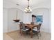 Charming dining area with wainscoting, elegant lighting, and coastal decor at 1313 Thornapple Dr, Osprey, FL 34229