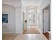 Bright entryway with double doors, transom window, and neutral decor at 1313 Thornapple Dr, Osprey, FL 34229