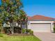 Charming single-story home boasts a well-manicured lawn, brick driveway and a tile roof at 1313 Thornapple Dr, Osprey, FL 34229