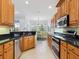 Spacious kitchen area with stainless steel appliances and a breakfast nook, bright and airy at 1313 Thornapple Dr, Osprey, FL 34229