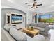 Inviting living room with comfortable seating and a view of the screened patio at 1313 Thornapple Dr, Osprey, FL 34229