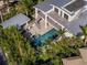 Aerial view showcasing a modern home with a pool, spa, and connecting walkway at 1365 Harbor Dr, Sarasota, FL 34239