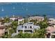 Aerial view of a luxury home with lush landscaping and a view of the bay at 1365 Harbor Dr, Sarasota, FL 34239