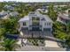 Stunning aerial view of a modern home with a three-car garage, lush landscaping at 1365 Harbor Dr, Sarasota, FL 34239
