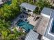Stunning aerial view of a modern home featuring a pool, spa, and lush tropical landscaping at 1365 Harbor Dr, Sarasota, FL 34239