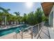Expansive backyard featuring a modern home, beautiful pool with fountains, and ample lounge space at 1365 Harbor Dr, Sarasota, FL 34239