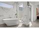 Bright bathroom features a modern tub with marble accents at 1365 Harbor Dr, Sarasota, FL 34239