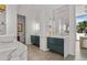 Modern bathroom includes double sinks, vanity, and marble countertop at 1365 Harbor Dr, Sarasota, FL 34239