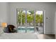 View from the bedroom showcases the inviting pool area and lush landscaping at 1365 Harbor Dr, Sarasota, FL 34239