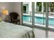 Bedroom view highlighting access to the pool area and surrounding greenery at 1365 Harbor Dr, Sarasota, FL 34239