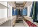 Organized walk-in closet with custom shelving and hanging space for clothes and accessories at 1365 Harbor Dr, Sarasota, FL 34239