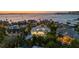 Stunning waterfront home featuring modern architecture and panoramic ocean views at sunset at 1365 Harbor Dr, Sarasota, FL 34239