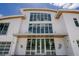 Modern home exterior featuring large windows, a covered entry, and a spacious three-car garage at 1365 Harbor Dr, Sarasota, FL 34239