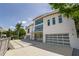 Bright, modern home showing the front elevation, large windows, and spacious driveway at 1365 Harbor Dr, Sarasota, FL 34239
