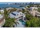 Stunning modern home featuring a metal roof, balconies, a pool, and waterfront views at 1365 Harbor Dr, Sarasota, FL 34239