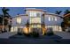 Contemporary home showcasing its front exterior, three-car garage, and desert landscaping at 1365 Harbor Dr, Sarasota, FL 34239